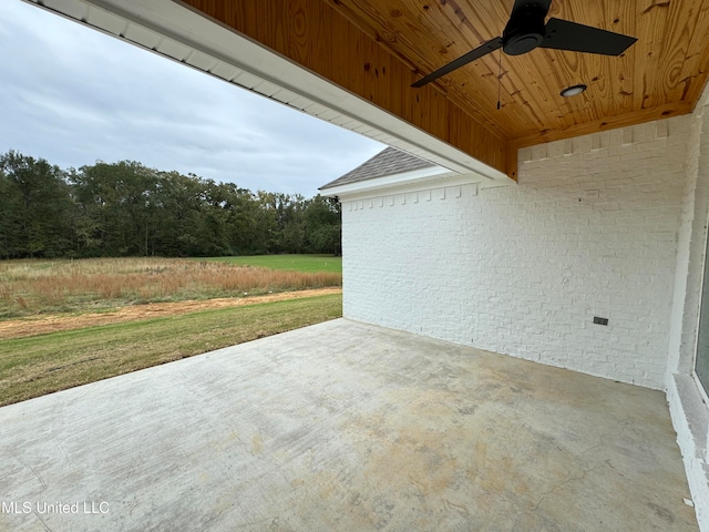 view of patio featuring ceiling fan