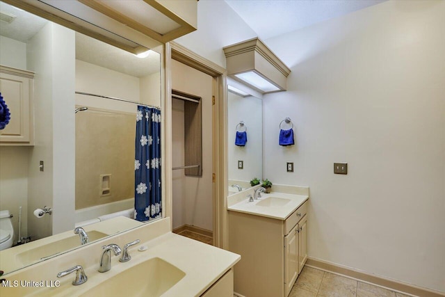 242 Commonwealth Ave, Brandon, MS 39047 - full bathroom featuring vanity, tile patterned floors, and shower / bath combination with curtain