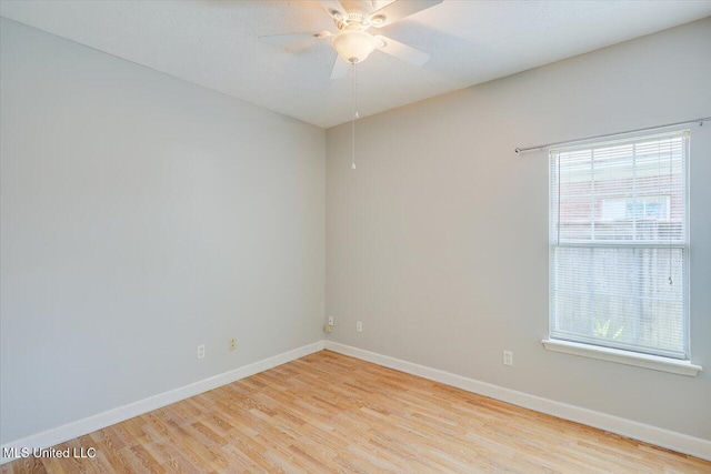 242 Commonwealth Ave, Brandon, MS 39047 - unfurnished room featuring light wood-style flooring, plenty of natural light, and ceiling fan