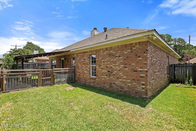 242 Commonwealth Ave, Brandon, MS 39047 - rear view of property featuring brick siding, a fenced backyard, and a chimney