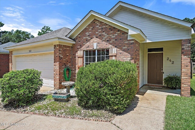 242 Commonwealth Ave, Brandon, MS 39047 - view of front of home with brick siding, an attached garage, and a shingled roof