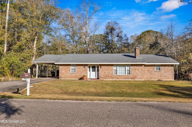 ranch-style home with an attached carport, a chimney, brick siding, aphalt driveway, and a front lawn