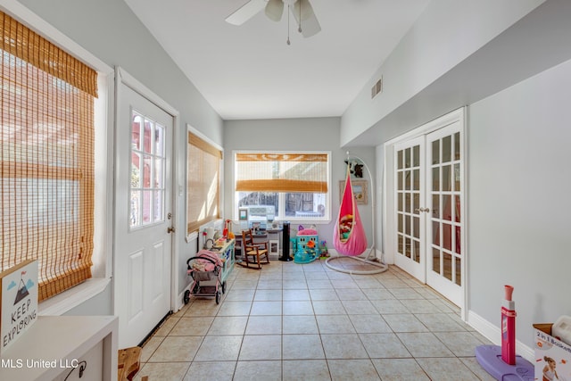 interior space featuring ceiling fan, visible vents, french doors, and light tile patterned floors