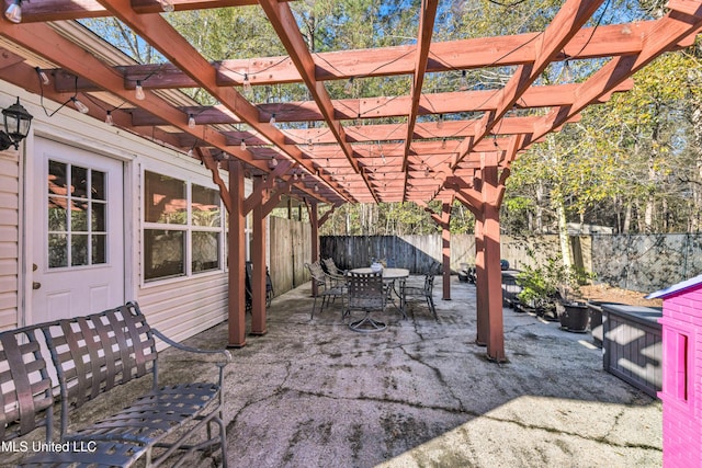 view of patio with a fenced backyard, outdoor dining area, and a pergola