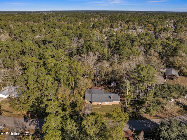 aerial view with a wooded view