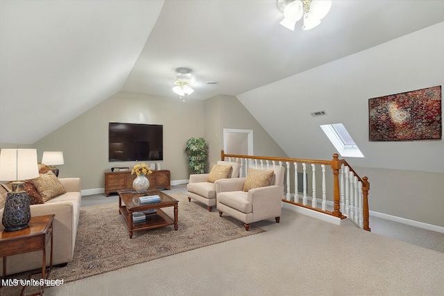 2674 S Slayden Rd, Lamar, MS 38642 - carpeted living room with ceiling fan and lofted ceiling with skylight