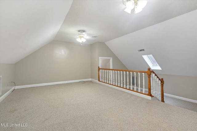 2674 S Slayden Rd, Lamar, MS 38642 - bonus room with ceiling fan, vaulted ceiling with skylight, and carpet floors