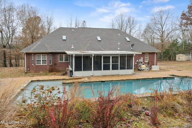 2674 S Slayden Rd, Lamar, MS 38642 - view of swimming pool featuring a patio area and a sunroom