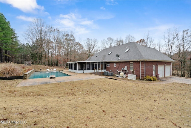 2674 S Slayden Rd, Lamar, MS 38642 - view of swimming pool with a sunroom, cooling unit, a yard, and a patio