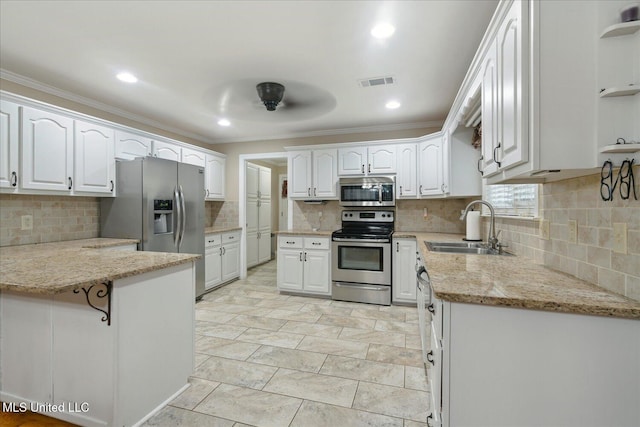 2674 S Slayden Rd, Lamar, MS 38642 - kitchen featuring white cabinets, light stone countertops, and stainless steel appliances