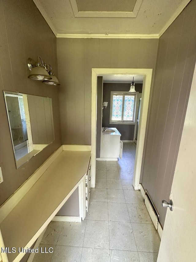 417 Boulevard St, Lexington, MS 39095 - corridor featuring baseboard heating, ornamental molding, and light tile patterned flooring