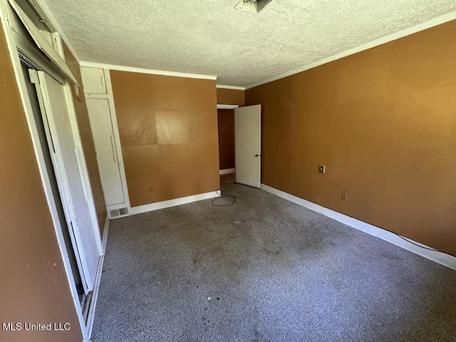 417 Boulevard St, Lexington, MS 39095 - unfurnished bedroom with a textured ceiling, ornamental molding, and baseboards