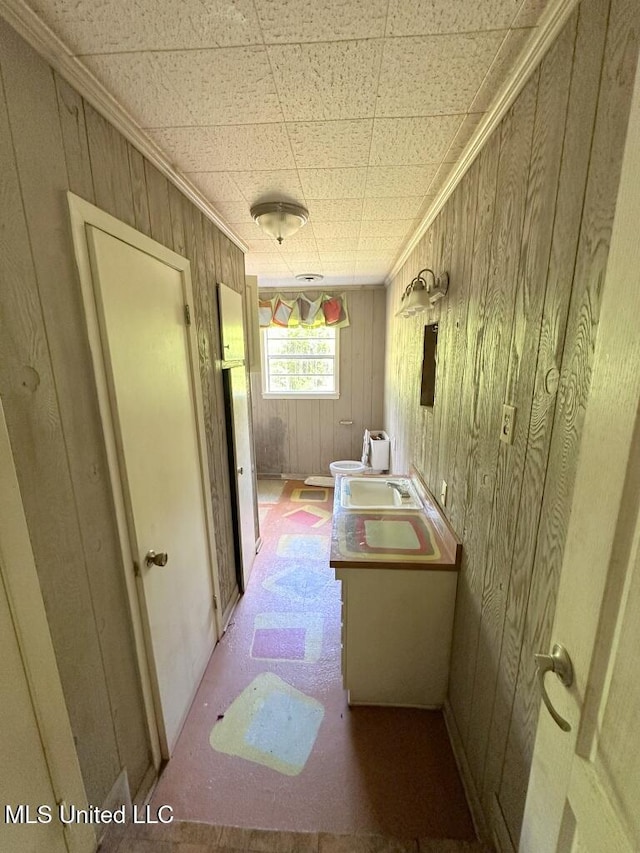 417 Boulevard St, Lexington, MS 39095 - bathroom featuring vanity, ornamental molding, toilet, a bidet, and wooden walls