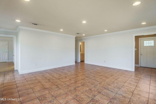 spare room with recessed lighting, visible vents, and crown molding