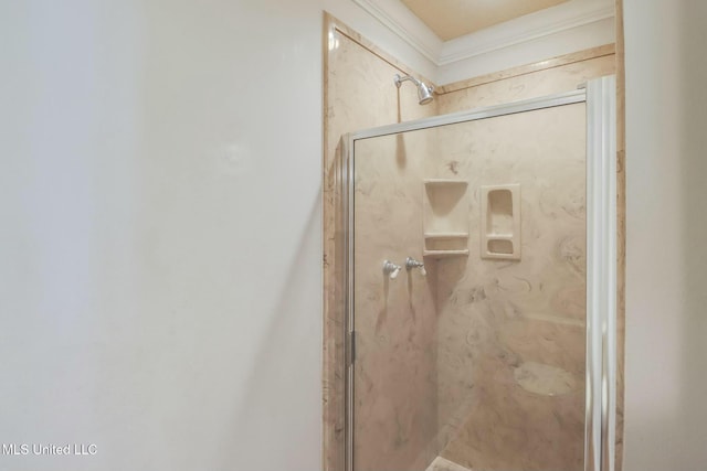 bathroom featuring a marble finish shower