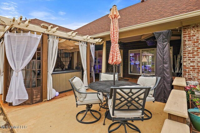 view of patio featuring a pergola and outdoor dining space
