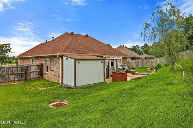 rear view of property with brick siding and a patio