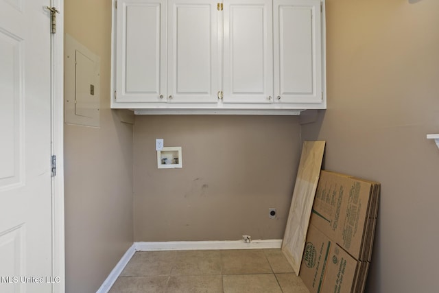 1013 Brashears Pt, Ridgeland, MS 39157 - washroom featuring electric panel, hookup for a washing machine, electric dryer hookup, cabinet space, and light tile patterned flooring