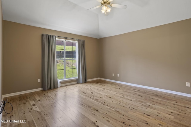 1013 Brashears Pt, Ridgeland, MS 39157 - empty room featuring a ceiling fan, vaulted ceiling, and light wood-style flooring