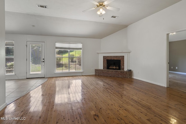 1013 Brashears Pt, Ridgeland, MS 39157 - unfurnished living room with hardwood / wood-style floors, ceiling fan, a fireplace, and vaulted ceiling