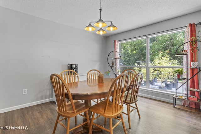 10510 Steeplechase Dr, Gulfport, MS 39503 - dining space with a textured ceiling, wood finished floors, and a chandelier