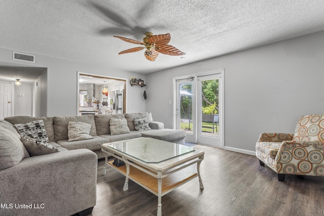 10510 Steeplechase Dr, Gulfport, MS 39503 - living area featuring ceiling fan, wood finished floors, and a textured ceiling