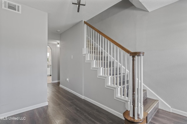10510 Steeplechase Dr, Gulfport, MS 39503 - stairway featuring wood finished floors and arched walkways