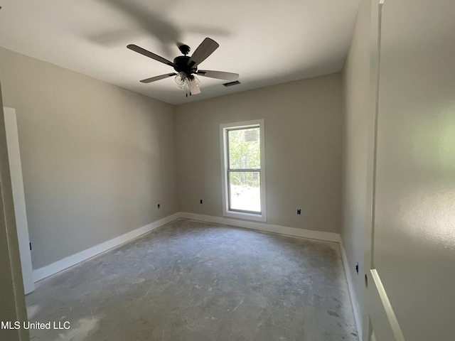 368 Magnolia Cir, Sarah, MS 38665 - unfurnished room with baseboards, ceiling fan, unfinished concrete flooring, and visible vents