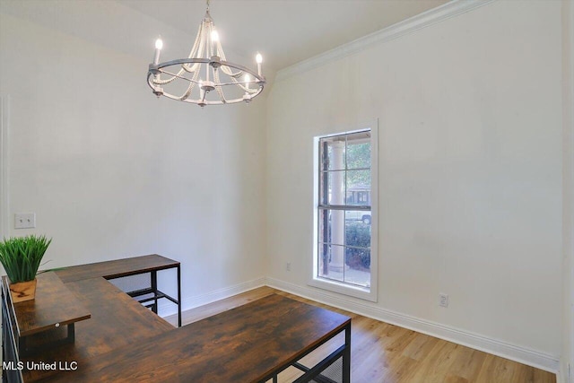 home office featuring light wood-type flooring, a chandelier, and crown molding