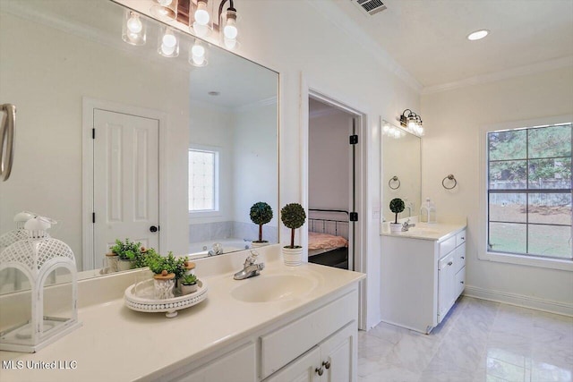 bathroom featuring a bath, vanity, and crown molding