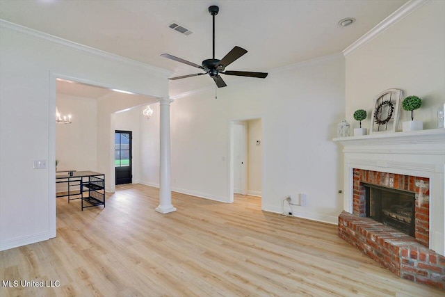 living room featuring a brick fireplace, ceiling fan, light hardwood / wood-style flooring, and crown molding