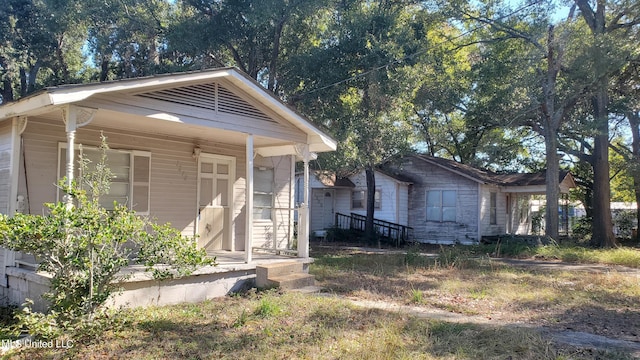 bungalow-style home featuring covered porch