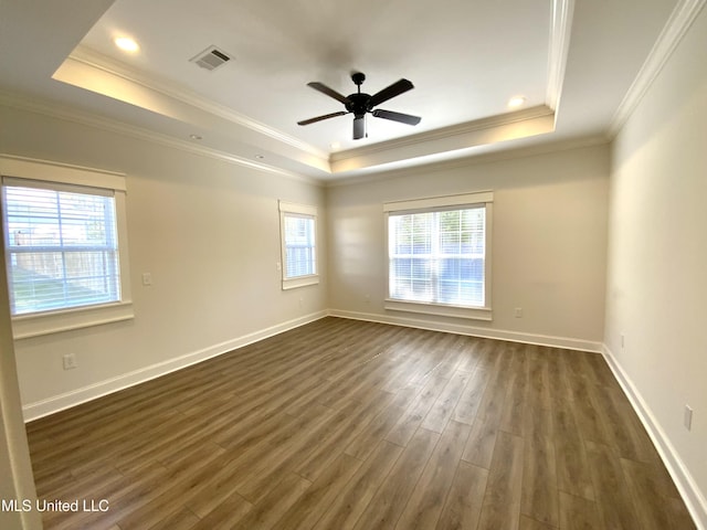 182 Sweetbriar Cir, Canton, MS 39046 - empty room with a tray ceiling, dark wood finished floors, crown molding, a ceiling fan, and baseboards