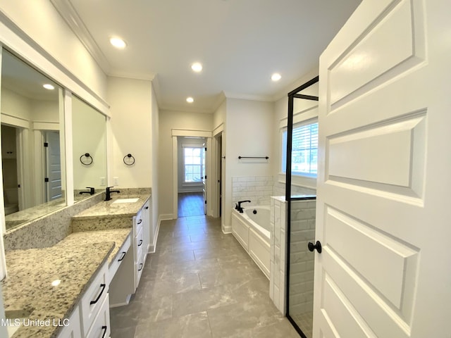 182 Sweetbriar Cir, Canton, MS 39046 - bathroom with vanity, crown molding, a garden tub, baseboards, and recessed lighting