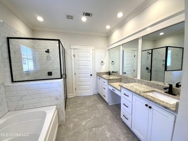 182 Sweetbriar Cir, Canton, MS 39046 - full bath featuring a stall shower, crown molding, a bath, double vanity, and recessed lighting