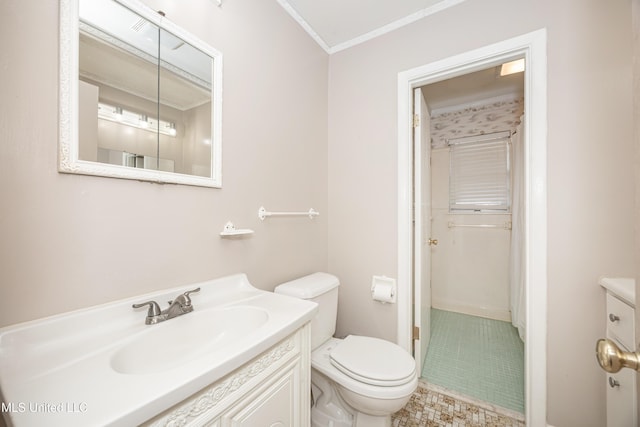 bathroom featuring vanity, toilet, and crown molding