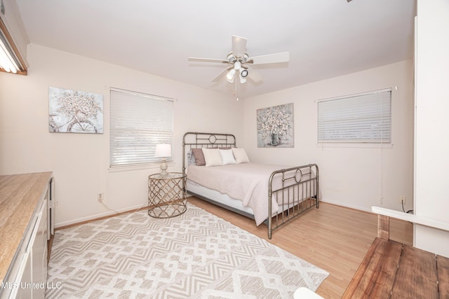 bedroom featuring ceiling fan and light wood-type flooring