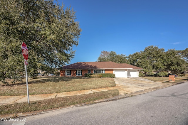 view of front facade featuring a front lawn and a garage