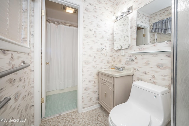 bathroom featuring tile patterned floors, curtained shower, vanity, and toilet