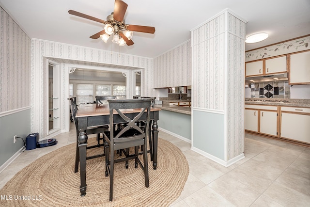 dining space featuring ceiling fan and light tile patterned floors