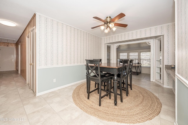 tiled dining area featuring ceiling fan