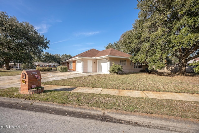 view of front facade featuring a garage and a front lawn