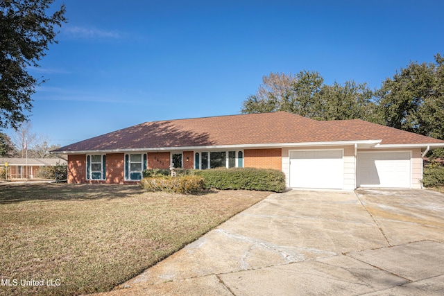 single story home featuring a front yard and a garage