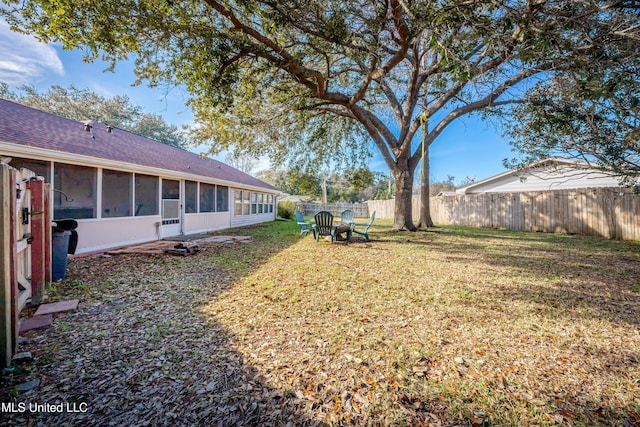 view of yard featuring a sunroom