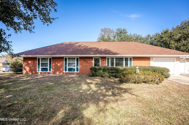 ranch-style house with a garage and a front lawn