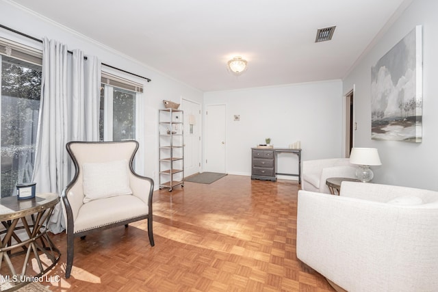 sitting room with plenty of natural light, parquet floors, and ornamental molding