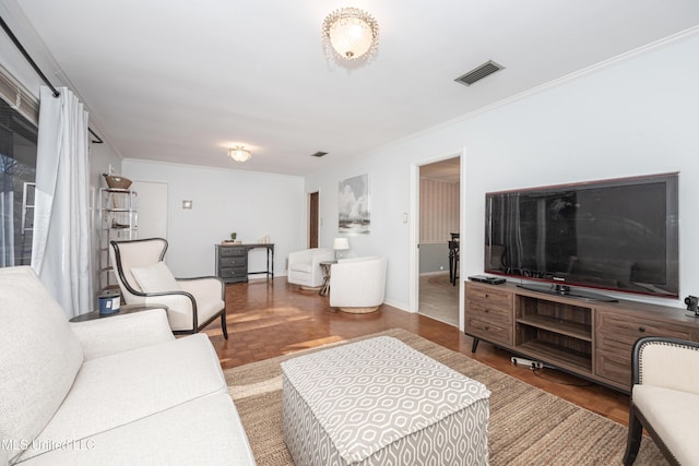 living room featuring ornamental molding and parquet flooring