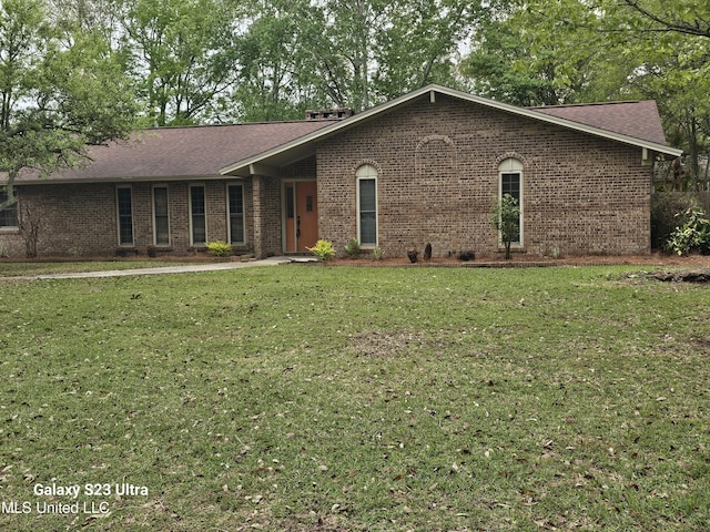 43 Greenbriar Dr, Gulfport, MS 39507 - ranch-style house with brick siding, roof with shingles, and a front yard