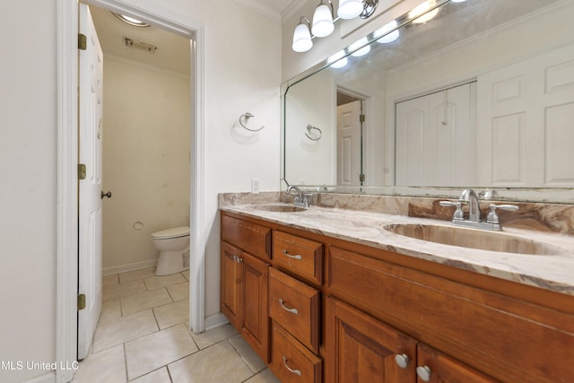 43 Greenbriar Dr, Gulfport, MS 39507 - bathroom with toilet, a sink, crown molding, and tile patterned floors