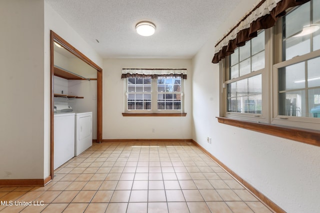 43 Greenbriar Dr, Gulfport, MS 39507 - interior space featuring light tile patterned flooring, independent washer and dryer, baseboards, and a textured ceiling